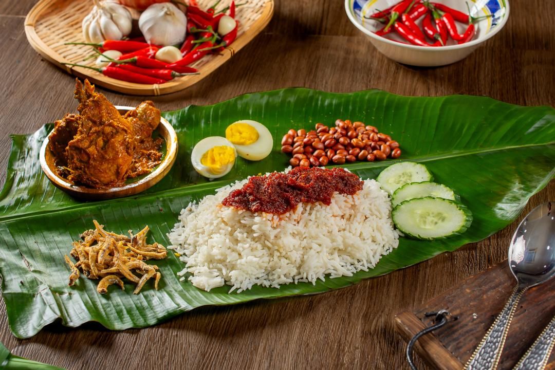 Nasi lemak with chicken rendang